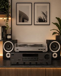 Vinyl record player  with vintage stereo and Polk bookshelf speakers