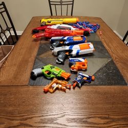 Assorted Nerf Guns with some darts 