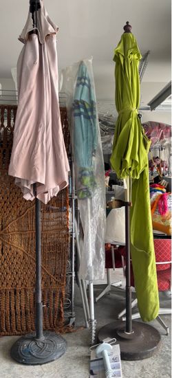 Outdoor umbrellas and stands