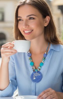 Handmade Turquoise-Color Blue Resin Dolphin Pendant Beaded Black Cord Necklace. This item is a handmade dolphin pendant necklace featuring blue and tu