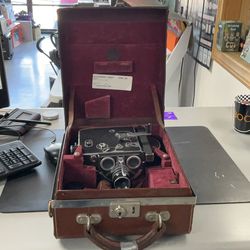 Vintage film camera in case with accessories
