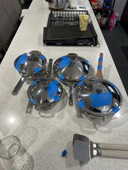 Pot and pans set of 4, price is for all 4 8.5 inch pan and pot  10.5 inch pans 2 of them one deeper  Used once  Brand: our place  Pick up only  Locate