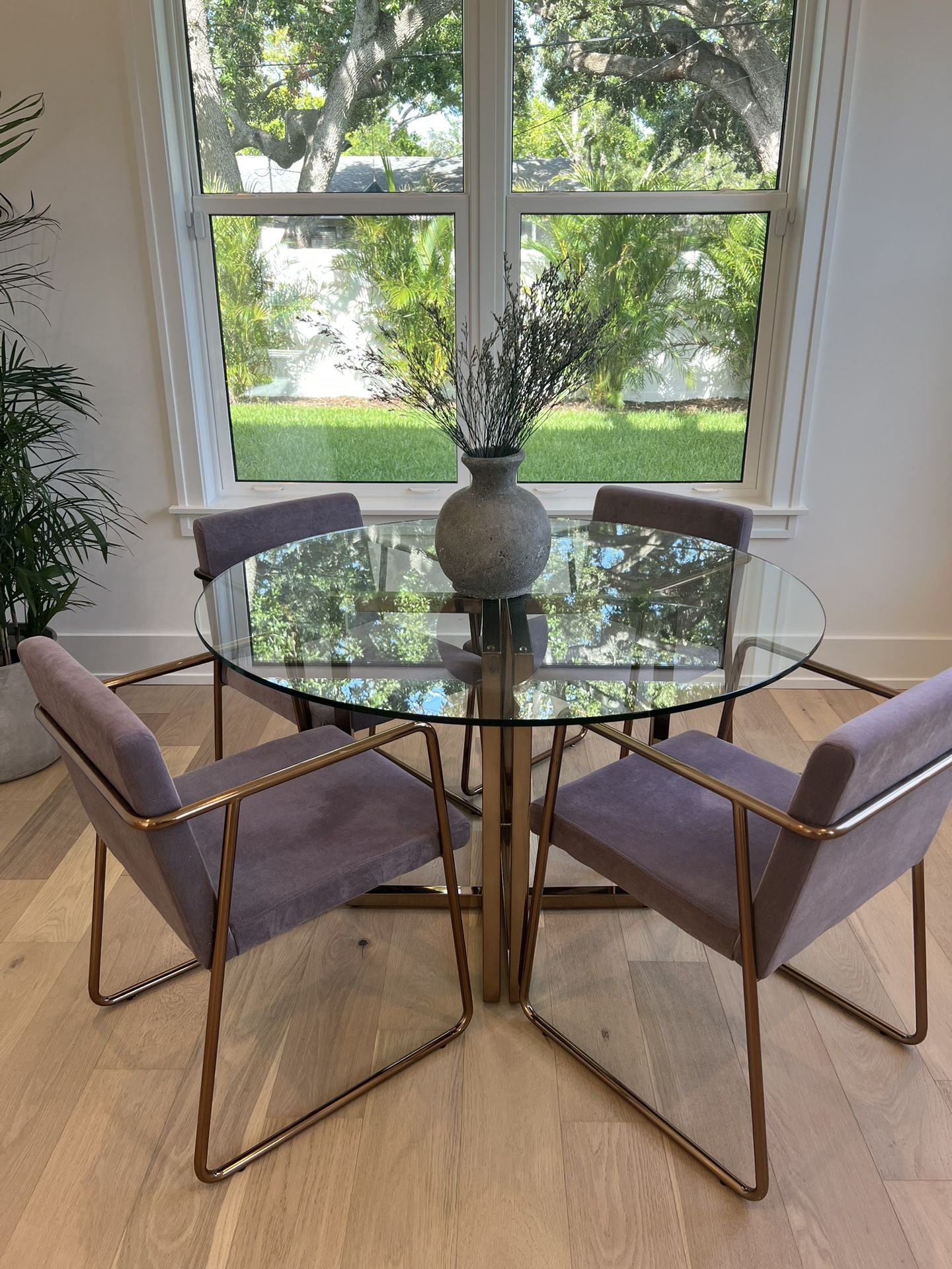 Silverado 47" Round Brass Dining Table + 4 Chairs: CB2