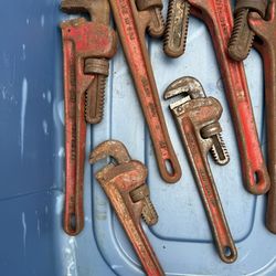 Assorted pipe, wrenches