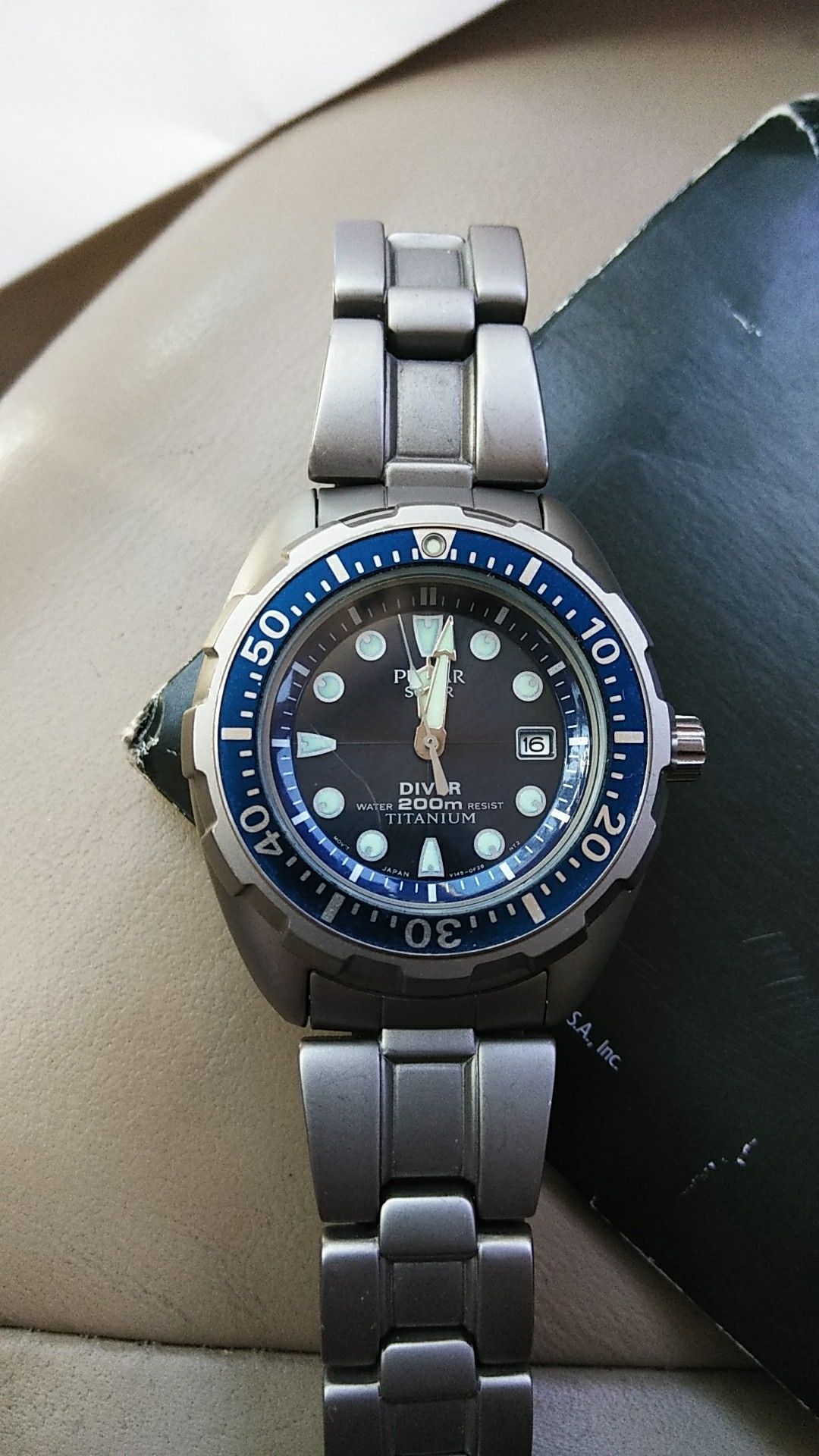 Pulsar titanium, 200 meter solar powered watch.