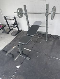 bench press with bar and 2 25(comes with heavy duty rubber mats)
