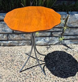 Small  side table with sprayed  dark steel gloss legs and custom cut top from panoramacity.