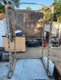 Squat rack+ Olympic bar+ 2x45lbs