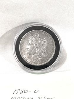 About uncirculated sealed in capsule 1880-O Morgan Silver Dollar. Valued $101 on US coin book.