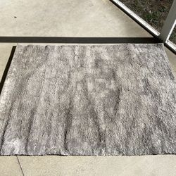 Area rug. 5x7 feet. Gray.  Needs cleaning. 
