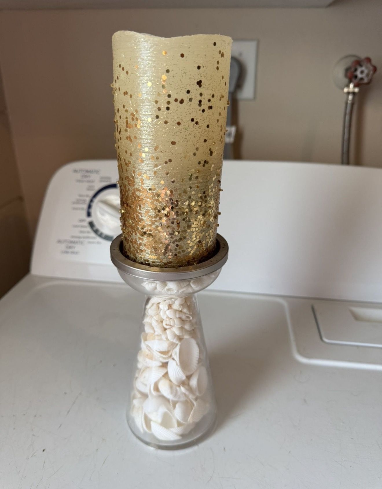  Shell filled candle stick holder with battery operated candle batteries not 