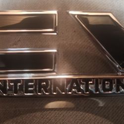 Chrome and black CV International self adhesive emblem.