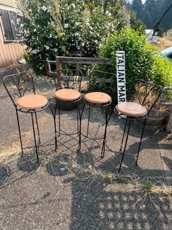 vintage-style wrought iron bar stools