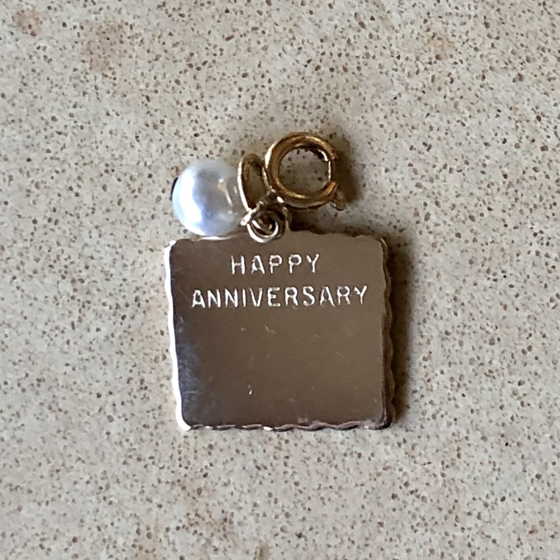✴️ Pretty, unused, vintage, gold tone Happy Anniversary square charm with faux pearl & lobster clasp