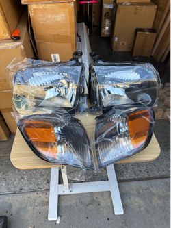 headlight and corner light assemblies for a 2001-2004 Toyota Tacoma crew cab