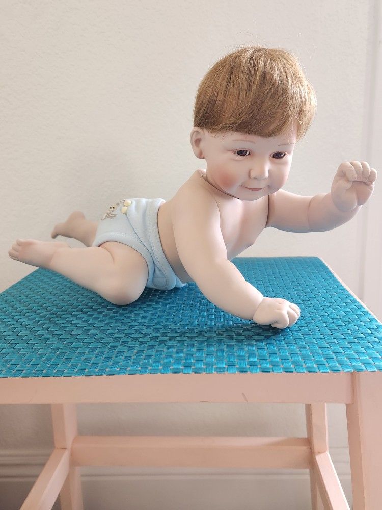 The Ashton Drake Galleries Snug In A Rug baby