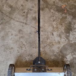 Rolling magnetic floor sweeper