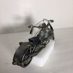 Motorcycle handmade out of nuts, spark plug and bolts