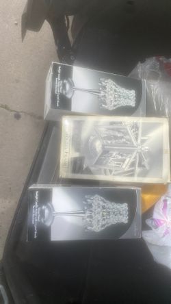 To light candles and they stand where you could put five photos