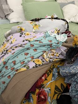 Full Bag Of Dresses And Knit Sweaters