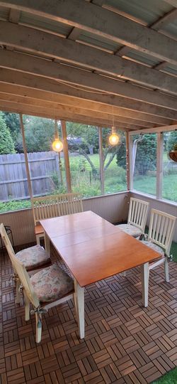 Wooden table set with chairs and bench