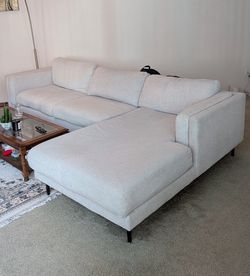 Beautiful sectional couch with ottoman from living Spaces