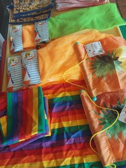 Party Stuff, All New,  4 Minion Bags, 32 Popcorn Bags, 4 Beach net Bags, 6 Table  Mats, And Two Decorative hanging Flags.  Never Used .