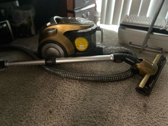 Equinox canister Vacuum Cleaner with controllable suction levels on handle