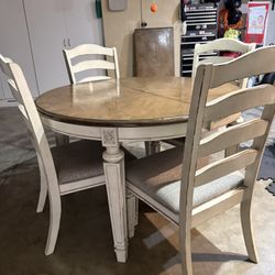 Realyn Dining Table and 4 Chairs