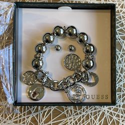 Guess charm bracelet and earring set in a BOX