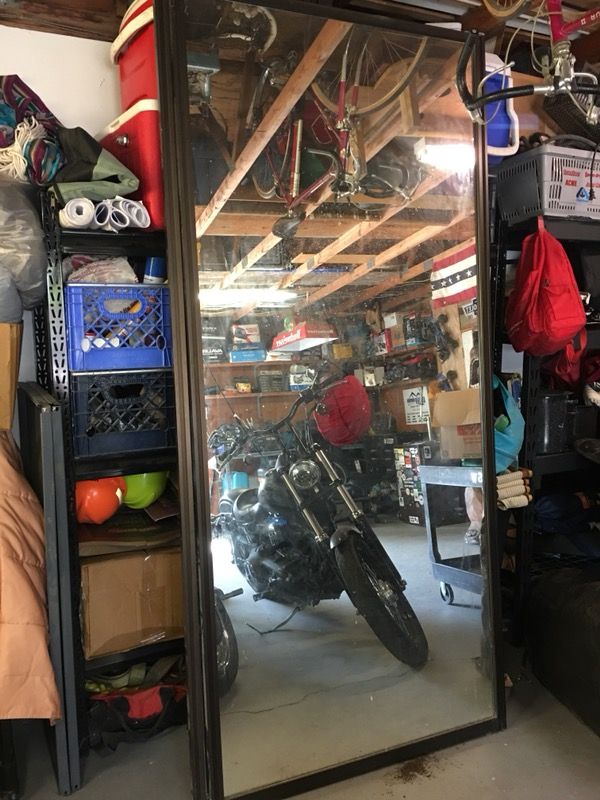 2 sets of Bronze mirrored closet doors.