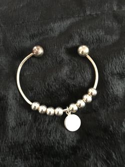 Monogram style sterling silver bracelet.