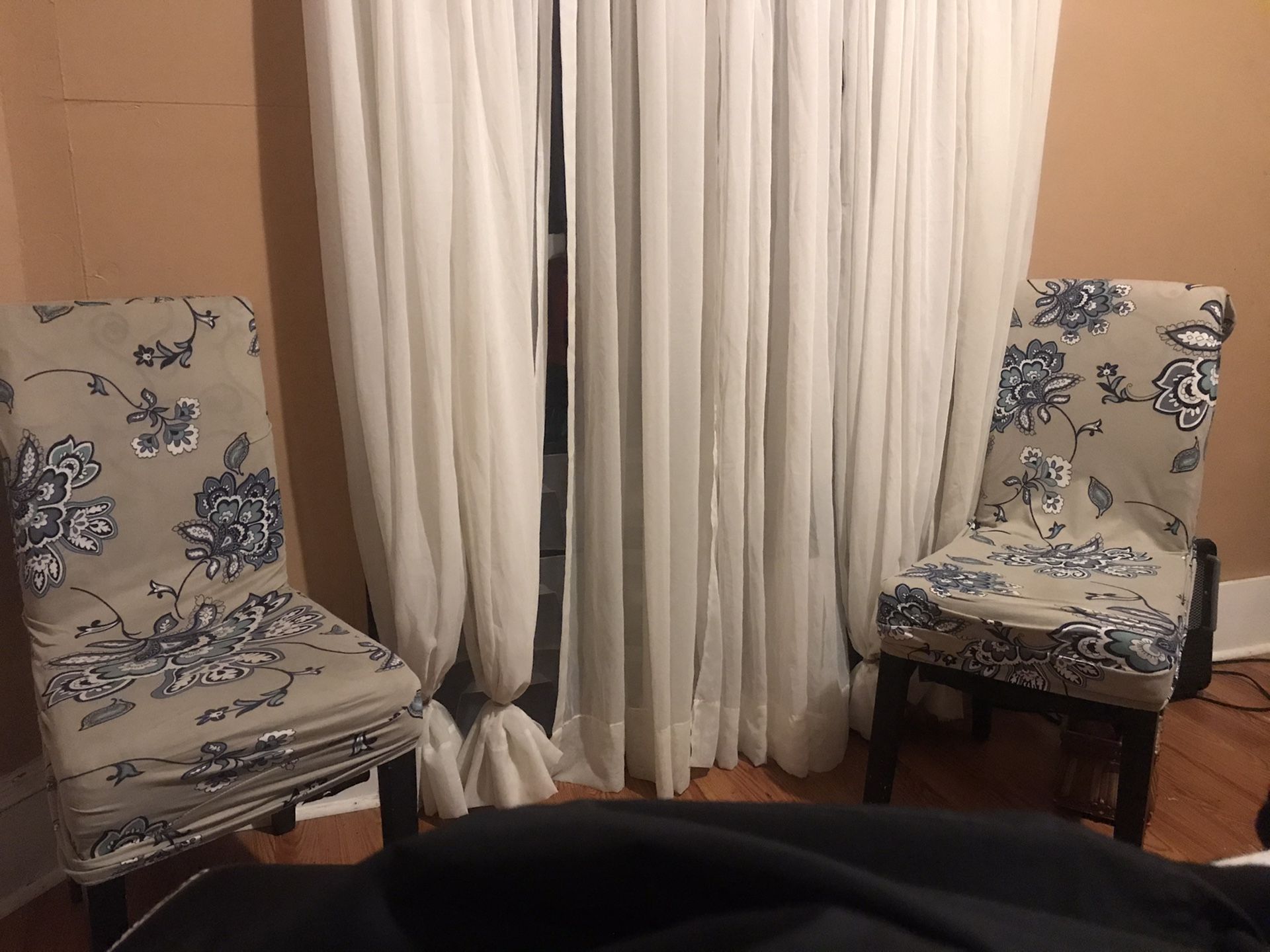 2 chairs with covers