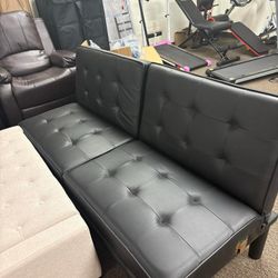 Black couch with attachable pieces.Turns into sofa bed. 32’in H x 25’in W x 66’in L