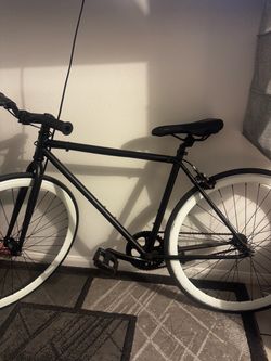 Golden cycles black and white bike