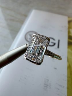 Certified  F VS1 4.5 CT emerald cut diamond ring . Custom floating setting 18k white/yellow gold