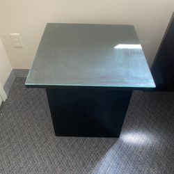 A stylish table, the base of which is covered with leather