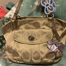 Coach Tan Purse with bow charm. 