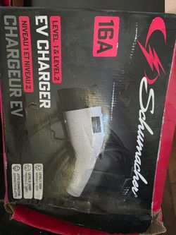This Schumacher SC1455 Level 1 & Level 2 Portable EV Charger (16 Amp) open box outer box damaged  due to storage but charger is new