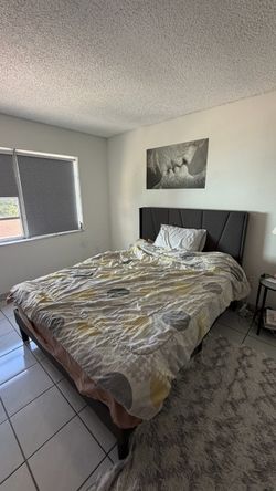 Queen bed with headboard and mattress