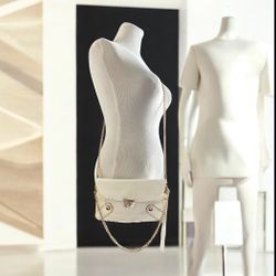 Designer ivory/white with gold chains over the shoulder or cross body leather handbag