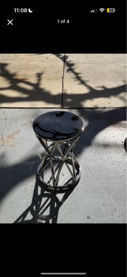 Set of two round marble tables