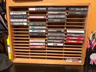 Some tapes and a tape player holder
