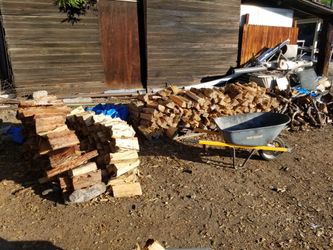 Mixed Firewood By The Wheelbarrow Full