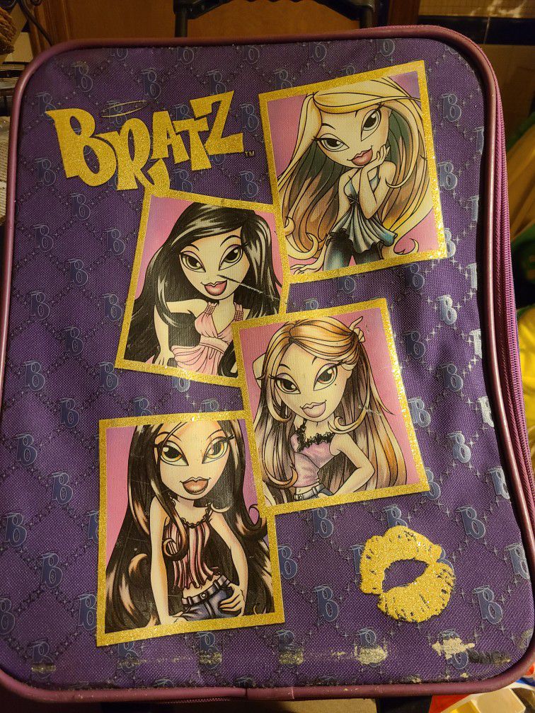 Bratz tote suitcase, zipper works, toggle and bars on back have rust. Handle collapses, has wheels, good for storage, bug out bag. East, west or north