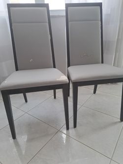 Pair gray padded wood frame cushion chairs