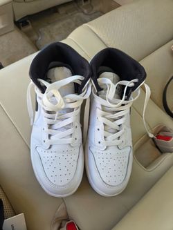 Air jordan 1 mid sneakers in the classic black and white