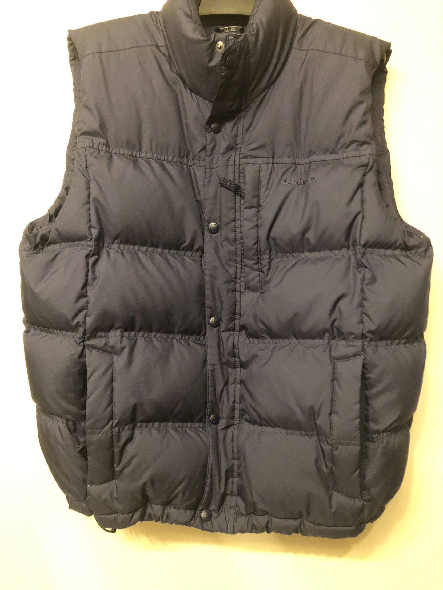 ll bean puffer vest size L navy blue nylon full zip.  measurements: lay flat  . shoulder length: 18” . pit to pit: 24” . length: 29” excellent used co