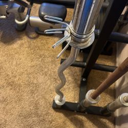 Olympic Curl Bar With Spinning Collars Comes With Weight Clips 
