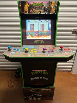 Used arcade 1up Ninja turtles arcade 4 player with riser